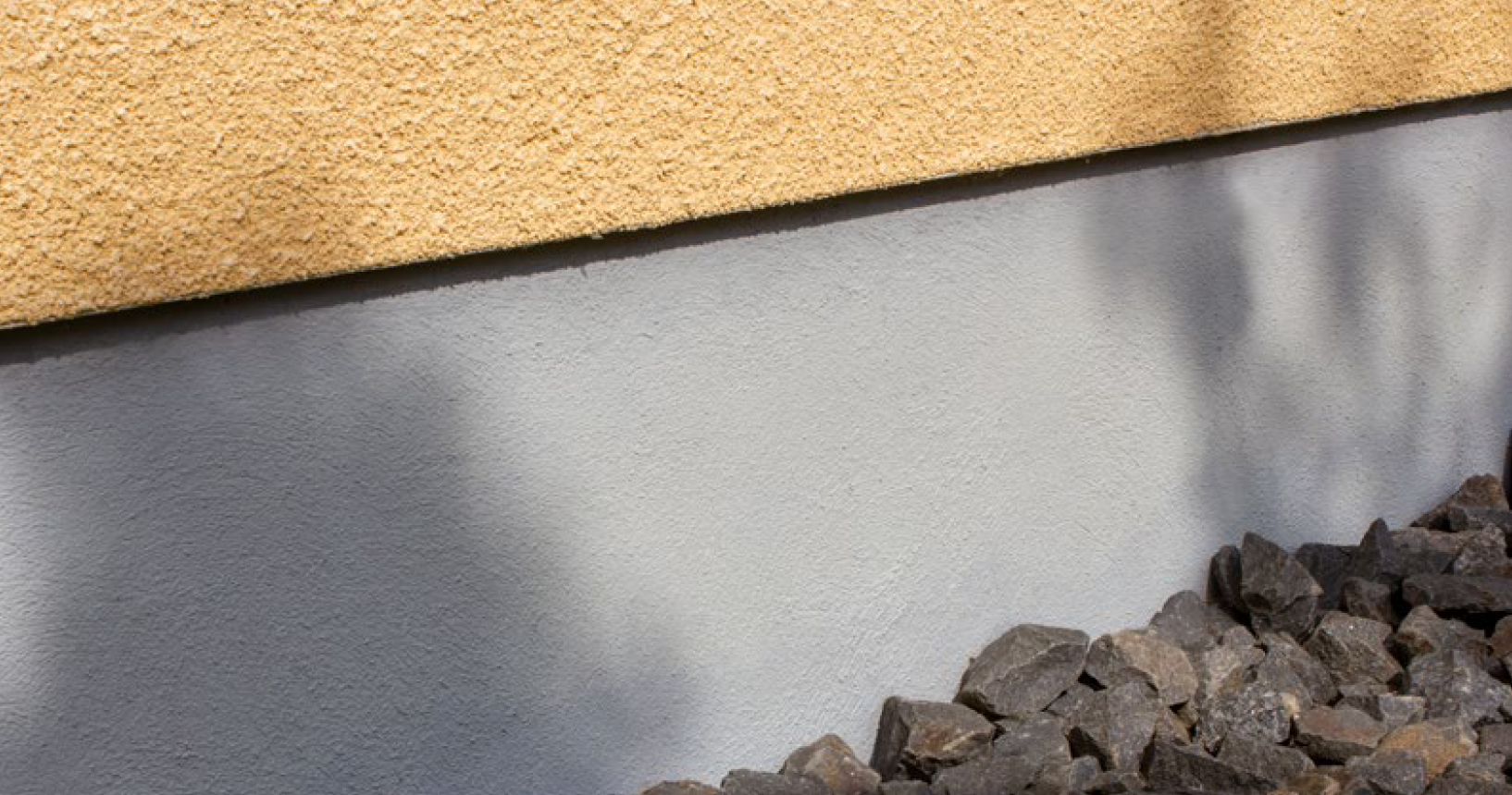 En inzoomad grå husgrund. 