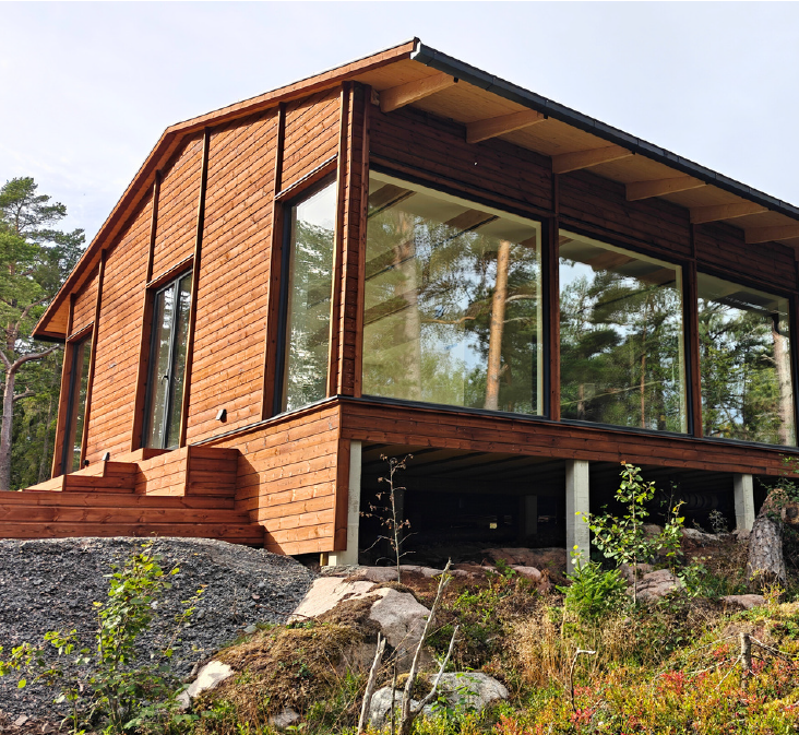 En timmerstuga med prefab från Husfabriken