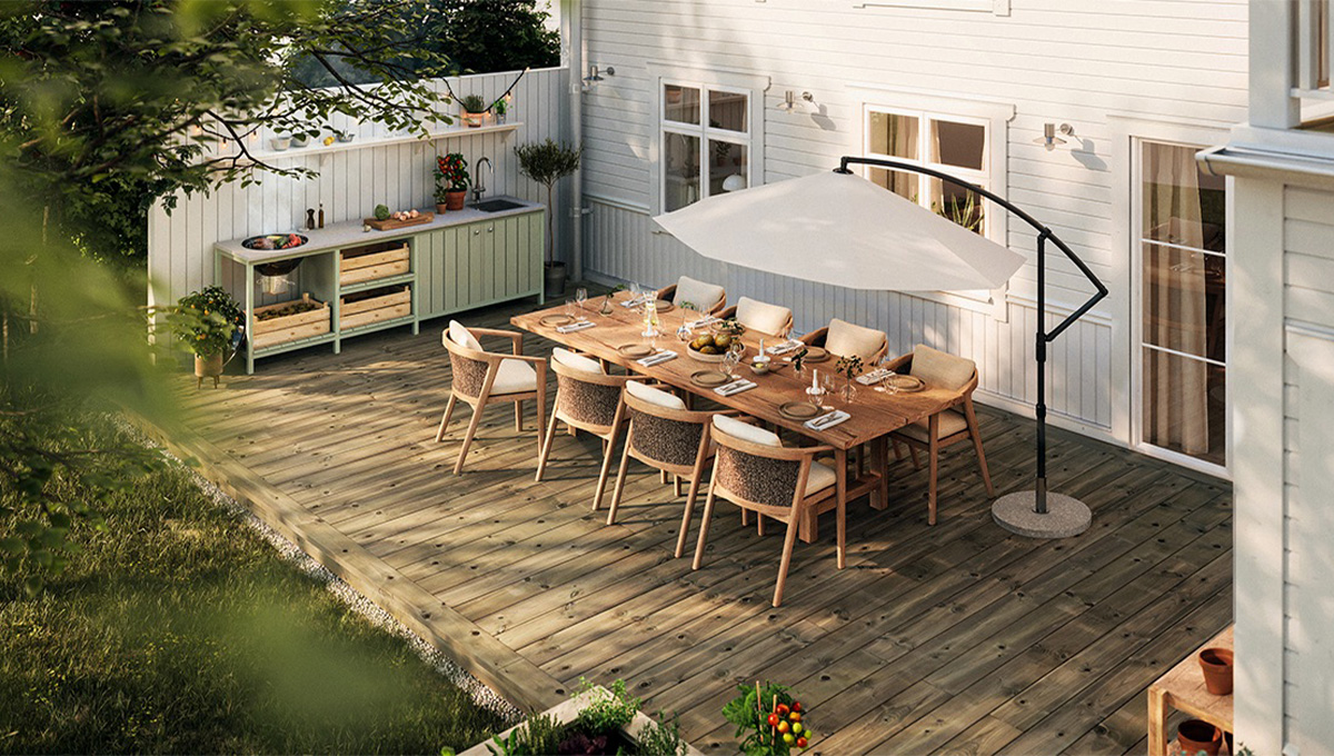 Trall från beijer byggmaterial på en altan vid en modern vit trävilla en sommardag.
